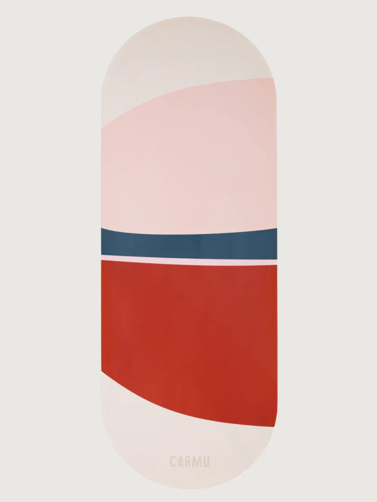 Oval yoga mat with pink dark red and blue geometric design